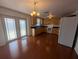 Bright eat-in kitchen featuring light wood cabinets, white appliances, and hardwood floors at 10968 105Th Ave, Largo, FL 33778