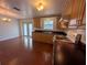 The kitchen features wood cabinets, modern appliances, and hardwood floors and natural light at 10968 105Th Ave, Largo, FL 33778