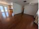 Hardwood floors extend from the open living room to the kitchen with bright natural light at 10968 105Th Ave, Largo, FL 33778