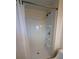 All-white shower with built-in shelves and a shower curtain at 10968 105Th Ave, Largo, FL 33778