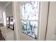 Close up of the decorative glass on the front door adding elegance and privacy to the entryway at 11 Lafayette St, Bradenton, FL 34208
