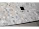 Walk-in shower floor with hexagon tile and a square drain at 11 Lafayette St, Bradenton, FL 34208