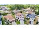 Aerial view of a home featuring solar panels, a well-manicured lawn, and a private backyard pool at 1105 Canyon Oaks Dr, Brandon, FL 33510