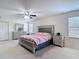 Bedroom featuring a ceiling fan, bedside tables, and a closet at 1105 Canyon Oaks Dr, Brandon, FL 33510
