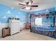 Fun ' bedroom with vibrant blue walls, cloud accents, and a bunk bed for a playful atmosphere at 1105 Canyon Oaks Dr, Brandon, FL 33510