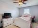 Cozy bedroom with natural light, a ceiling fan, and a neutral color palette at 1105 Canyon Oaks Dr, Brandon, FL 33510
