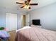 Bedroom featuring a ceiling fan, a closet and a television at 1105 Canyon Oaks Dr, Brandon, FL 33510