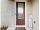 A decorative glass front door with welcome mat and 'Welcome to our Home' sign at 1105 Canyon Oaks Dr, Brandon, FL 33510