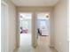 Hallway with open doorways leading to bedrooms with ceiling fans at 1105 Canyon Oaks Dr, Brandon, FL 33510