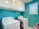 Laundry room with washer, dryer, and upper cabinets for storage at 1105 Canyon Oaks Dr, Brandon, FL 33510