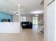 Open-concept living area with tile flooring, modern lighting, and a view of the backyard at 1105 Canyon Oaks Dr, Brandon, FL 33510
