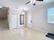 A spacious living room features tile floors, a ceiling fan, and a chandelier at 1105 Canyon Oaks Dr, Brandon, FL 33510