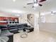 Spacious living area with tile flooring and smooth transition into the kitchen and staircase at 1105 Canyon Oaks Dr, Brandon, FL 33510