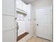 Charming mudroom features built-in storage cabinets and a wooden bench for convenience and organization at 1105 Canyon Oaks Dr, Brandon, FL 33510