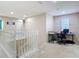 Upstairs office with carpet and a simple desk, perfect for a quiet and productive workspace at 1105 Canyon Oaks Dr, Brandon, FL 33510