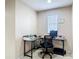 Cozy upstairs office nook with a modern desk setup, a black office chair, and natural lighting at 1105 Canyon Oaks Dr, Brandon, FL 33510