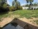Lawn of backyard featuring various shrubbery, grass and some patches of exposed soil at 1204 E Camellia Dr, Brandon, FL 33510