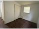 Bedroom with wood-look floors and closet at 1204 E Camellia Dr, Brandon, FL 33510