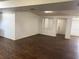 Spacious living area with wood floors, fresh white paint, and ample natural light at 1204 E Camellia Dr, Brandon, FL 33510