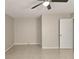 Spacious bedroom with neutral walls, tile flooring, and a ceiling fan at 12121 Wildbrook Dr, Riverview, FL 33569