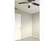 Bedroom featuring a ceiling fan and door at 12121 Wildbrook Dr, Riverview, FL 33569
