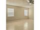 Spacious bedroom with neutral walls, two windows, a ceiling fan, and tile flooring at 12121 Wildbrook Dr, Riverview, FL 33569