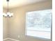 Dining space features a modern chandelier and large window with natural light at 12121 Wildbrook Dr, Riverview, FL 33569