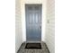 A sturdy, painted front door with decorative hardware provides a secure and stylish entrance to the home at 12121 Wildbrook Dr, Riverview, FL 33569