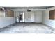 Spacious garage with water heater, air conditioning system, and concrete flooring at 12121 Wildbrook Dr, Riverview, FL 33569