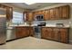 Open kitchen featuring tiled floors, stainless steel appliances, and ample cabinet space at 12121 Wildbrook Dr, Riverview, FL 33569
