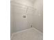 Compact laundry room featuring tile flooring and laundry hook-ups at 12121 Wildbrook Dr, Riverview, FL 33569