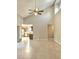 Bright, open living room with high ceilings, tile floors and a ceiling fan at 12121 Wildbrook Dr, Riverview, FL 33569