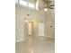 Open-concept living space boasts high ceilings, ample natural light, and neutral tones at 12121 Wildbrook Dr, Riverview, FL 33569