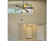 Bright living area features high ceilings, large windows, and a modern ceiling fan at 12121 Wildbrook Dr, Riverview, FL 33569