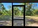 View from screened patio that overlooks the backyard offering a peaceful, bug-free outdoor living space at 12121 Wildbrook Dr, Riverview, FL 33569