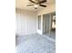 Covered outdoor patio with tile floor and ceiling fan, an inviting space for relaxation and enjoying the outdoors at 12121 Wildbrook Dr, Riverview, FL 33569