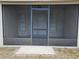 Enclosed patio with tile flooring and screen enclosure, creating a relaxing outdoor space at 12121 Wildbrook Dr, Riverview, FL 33569
