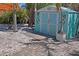 Close-up of outbuilding with surfboard decor in backyard, perfect for storage and beach living at 13123 4Th E St, Madeira Beach, FL 33708