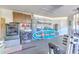 Spacious garage with laundry area, storage shelves, and sports equipment at 1666 Meadow Oak Ln, Tarpon Springs, FL 34689