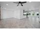 Open-concept living space featuring sleek tile floors and ample natural light at 1720 Emerald Dr, Clearwater, FL 33756