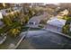 Aerial view of home and dock with lush landscaping and waterfront views at 179 Bath Club N Blvd, North Redington Beach, FL 33708
