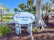 Friendship Park sign est. 1992, showcasing a community green space with manicured landscaping at 179 Bath Club N Blvd, North Redington Beach, FL 33708
