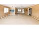 Open-concept living room with Terrazzo flooring, offering natural light from windows and a view to other rooms at 179 Bath Club N Blvd, North Redington Beach, FL 33708