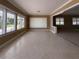 Bright and airy living room featuring large windows with waterfront views, enhancing the sense of tranquility and space at 179 Bath Club N Blvd, North Redington Beach, FL 33708