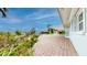 Inviting outdoor brick patio featuring a covered pergola, perfect for enjoying waterfront views and relaxation at 179 Bath Club N Blvd, North Redington Beach, FL 33708