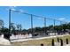 View of the City of Tampa Parks & Recreation volleyball courts with players and a large safety net at 2002 E Hanna Ave, Tampa, FL 33610