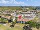 Community aerial view showcasing tennis courts, pool, garages, parking, landscaping, and nearby buildings at 2017 Skimmer W Ct # 416, Clearwater, FL 33762
