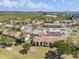Community aerial view showcasing tennis courts, pool, garages, parking, landscaping, and nearby buildings at 2017 Skimmer W Ct # 416, Clearwater, FL 33762
