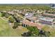Community aerial view showcasing tennis courts, pool, garages, parking, mature trees, and landscaping at 2017 Skimmer W Ct # 416, Clearwater, FL 33762