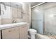 Bathroom featuring a modern vanity and walk-in shower with decorative stone floor at 2017 Skimmer W Ct # 416, Clearwater, FL 33762